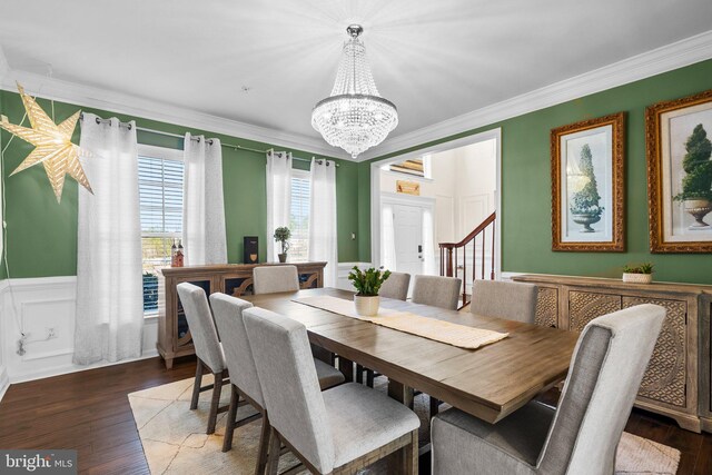 6616 Osborne Hill Dr, Upper Marlboro, MD 20772 - dining room with a chandelier, a decorative wall, ornamental molding, a wainscoted wall, and wood finished floors