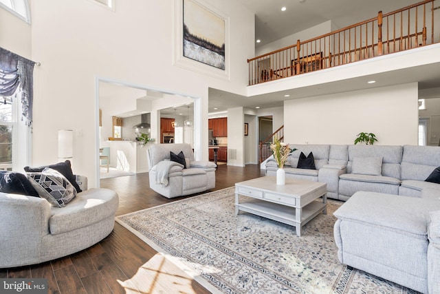 6616 Osborne Hill Dr, Upper Marlboro, MD 20772 - living area featuring a high ceiling, stairs, wood finished floors, and healthy amount of natural light