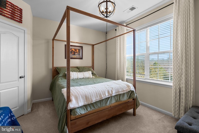 6616 Osborne Hill Dr, Upper Marlboro, MD 20772 - carpeted bedroom with baseboards and a chandelier