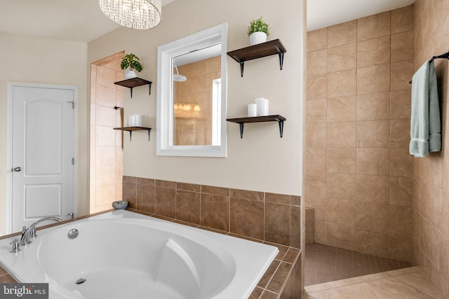 6616 Osborne Hill Dr, Upper Marlboro, MD 20772 - bathroom featuring a bath, a tile shower, and a chandelier