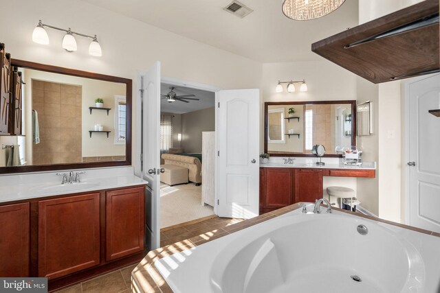 6616 Osborne Hill Dr, Upper Marlboro, MD 20772 - ensuite bathroom with a ceiling fan, a tub, tile patterned flooring, and vanity