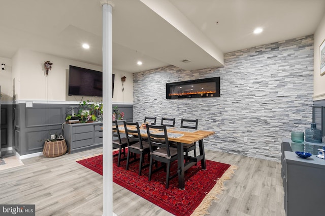 6616 Osborne Hill Dr, Upper Marlboro, MD 20772 - dining area featuring light wood-type flooring, a decorative wall, wainscoting, and recessed lighting