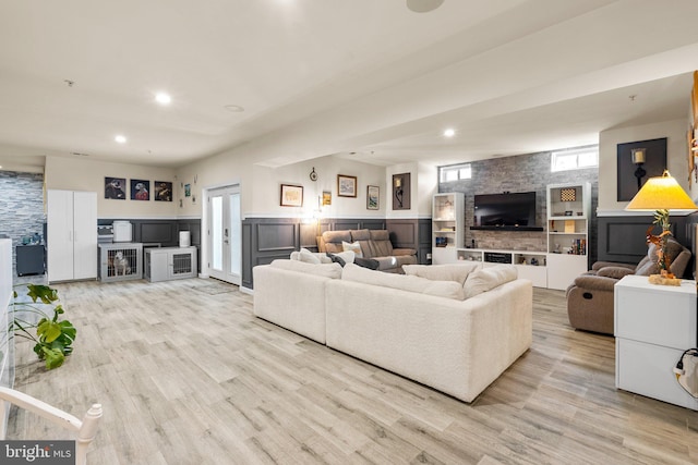 6616 Osborne Hill Dr, Upper Marlboro, MD 20772 - living room featuring a fireplace, light wood-type flooring, recessed lighting, and a wainscoted wall