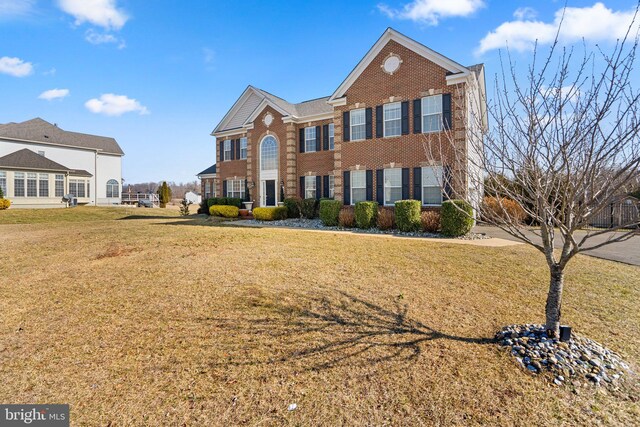 6616 Osborne Hill Dr, Upper Marlboro, MD 20772 - colonial house with brick siding and a front lawn