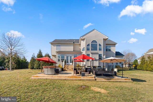 6616 Osborne Hill Dr, Upper Marlboro, MD 20772 - rear view of house with french doors, an outdoor hangout area, a patio area, a lawn, and a hot tub
