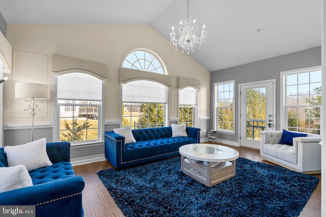 6616 Osborne Hill Dr, Upper Marlboro, MD 20772 - living room featuring a chandelier, wood finished floors, and high vaulted ceiling