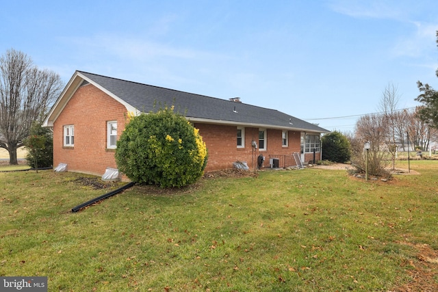 view of property exterior with a yard