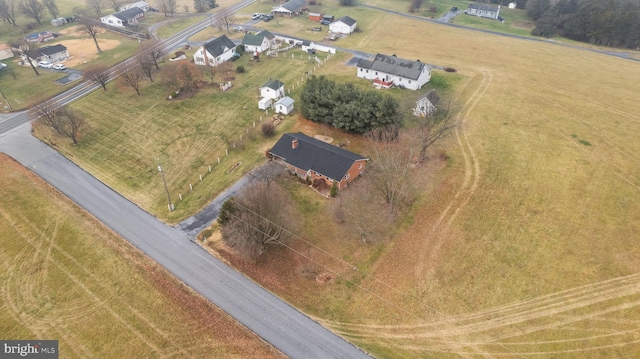 birds eye view of property featuring a rural view