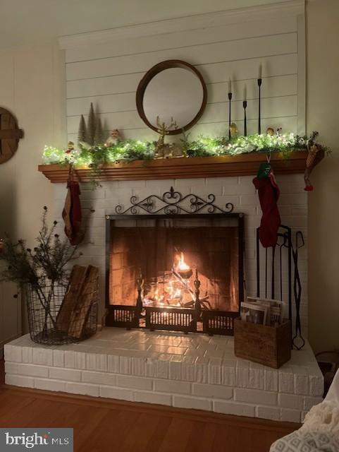 interior details featuring a fireplace and hardwood / wood-style floors