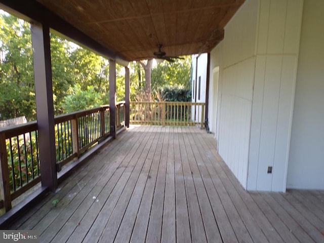 wooden terrace featuring ceiling fan