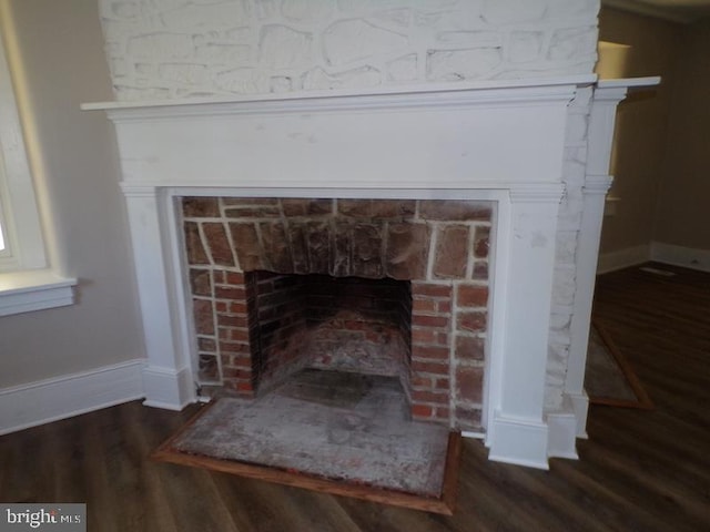 interior details featuring hardwood / wood-style floors and a fireplace