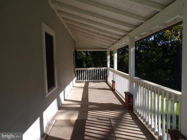 wooden terrace featuring a porch