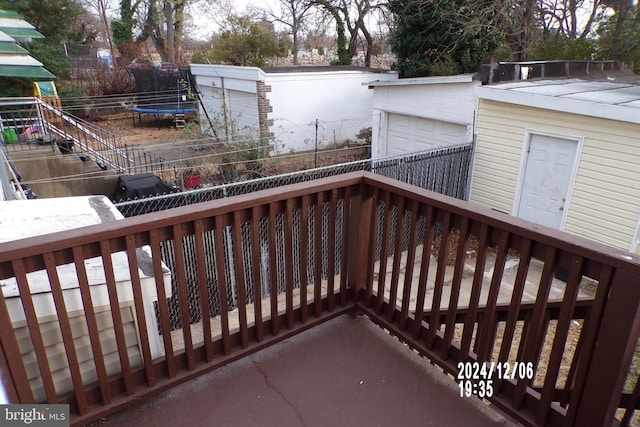 wooden deck featuring a trampoline