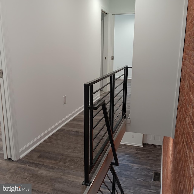 staircase featuring hardwood / wood-style flooring