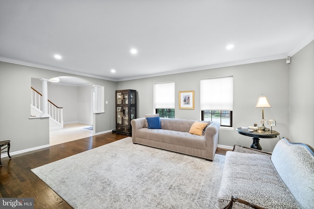 living room with ornamental molding, ornate columns, and dark wood-type flooring