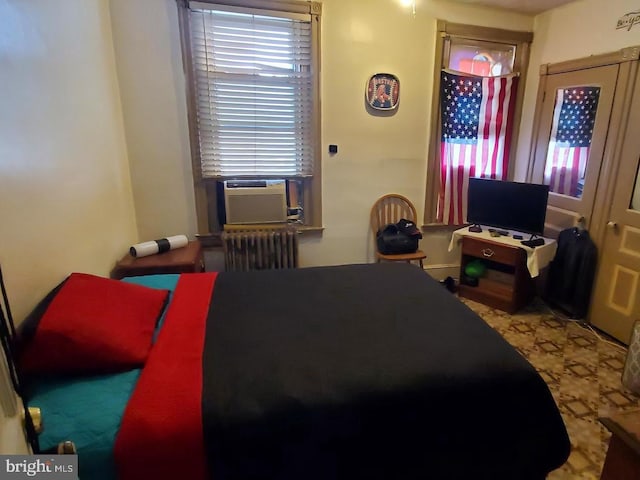 bedroom featuring radiator and cooling unit