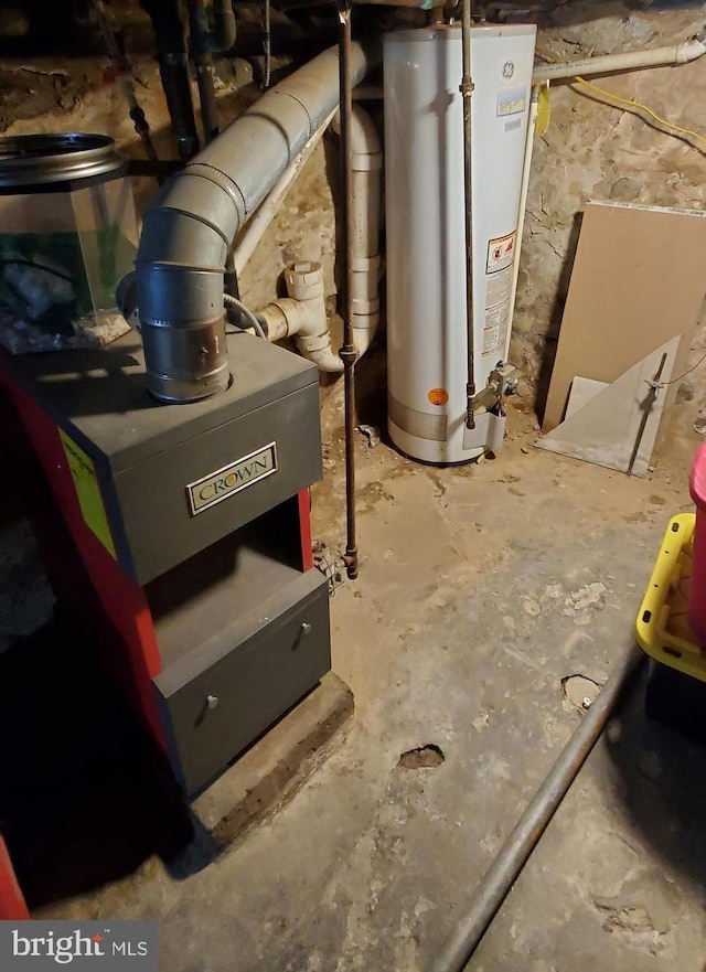 utility room featuring water heater