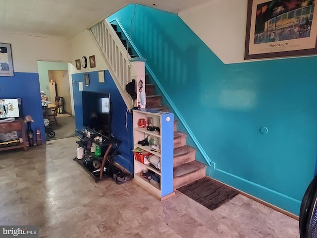 staircase with concrete flooring