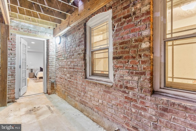 1408 10th St NW Unit 102, Washington, DC 20001 - corridor featuring brick wall and concrete floors