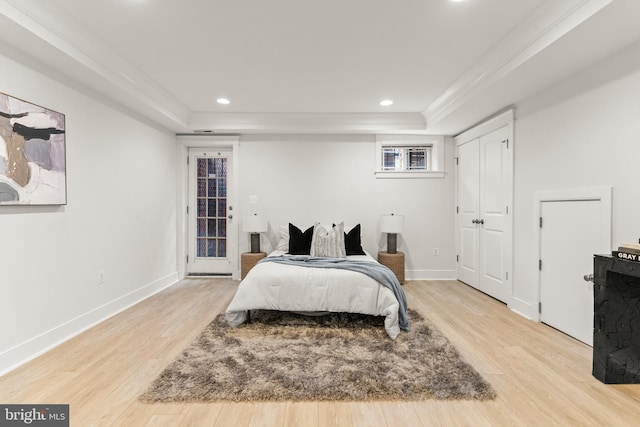 1408 10th St NW Unit 102, Washington, DC 20001 - bedroom with light wood-style floors, a raised ceiling, and recessed lighting