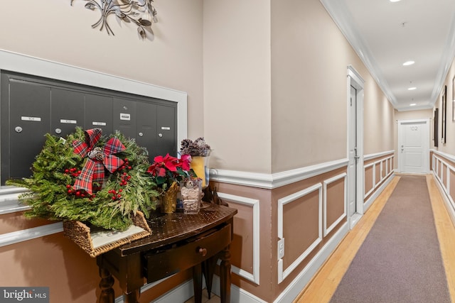 hall featuring crown molding and light wood-type flooring