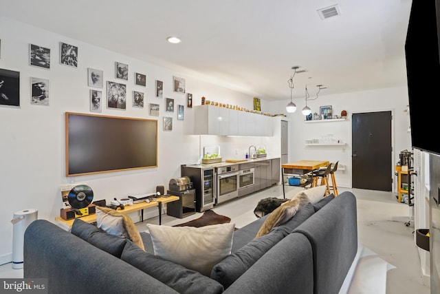 living room featuring sink and beverage cooler