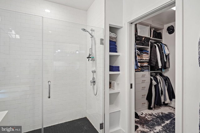 bathroom with a shower with shower door