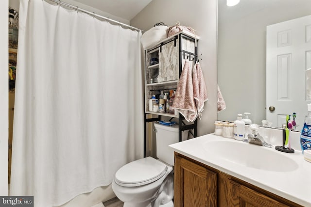 bathroom with vanity and toilet