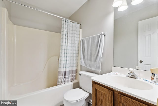 full bathroom with vanity, shower / bath combination with curtain, and toilet