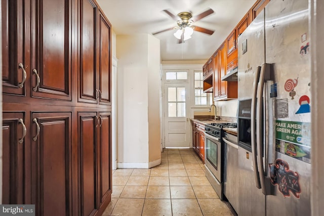 kitchen featuring sink, stainless steel appliances, ceiling fan, and light tile patterned flooring