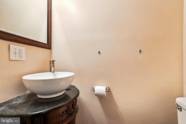 bathroom featuring toilet and sink