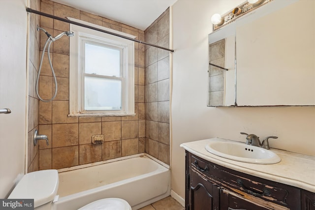 full bathroom featuring vanity, tiled shower / bath combo, and toilet