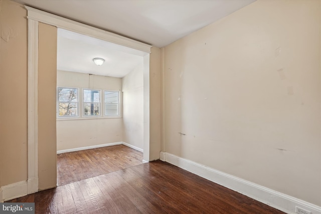 unfurnished room featuring hardwood / wood-style flooring