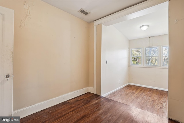 unfurnished room with hardwood / wood-style floors