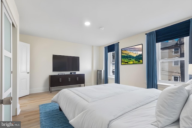 bedroom with light hardwood / wood-style flooring