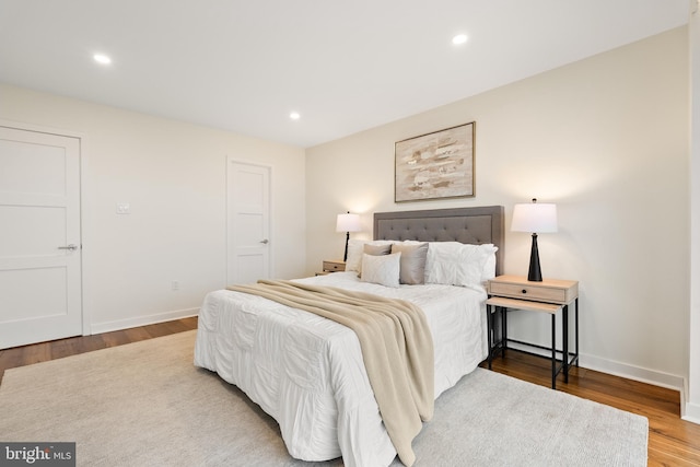 bedroom with wood-type flooring