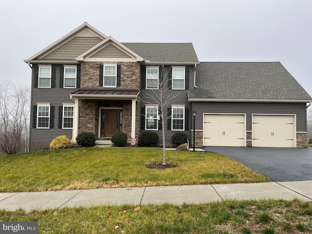 view of front facade featuring a garage and a front yard