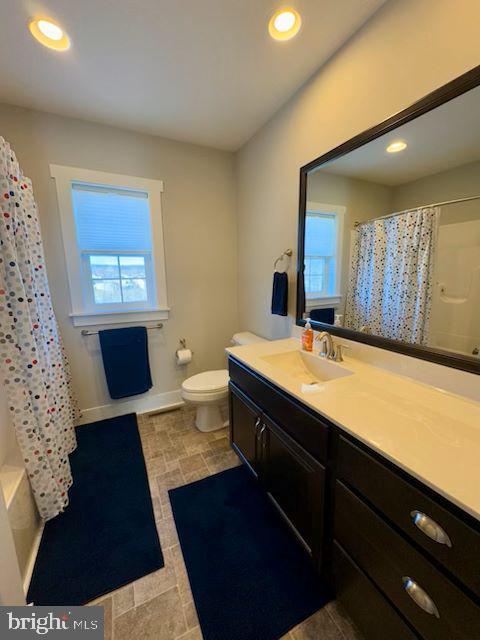 bathroom with vanity and toilet