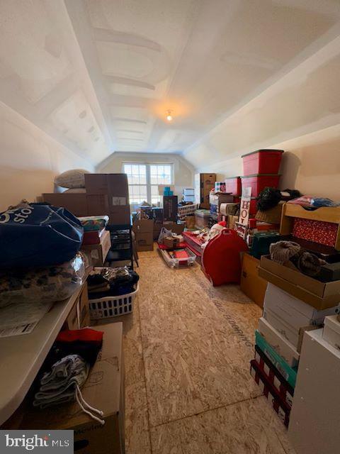 additional living space featuring lofted ceiling