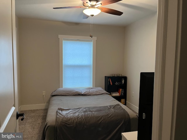 carpeted bedroom with ceiling fan