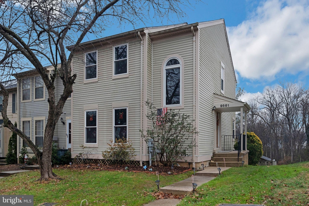 view of front of property with a front lawn