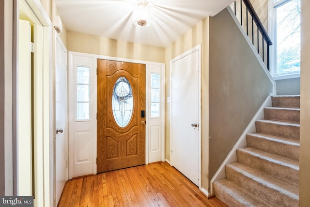 foyer with light hardwood / wood-style flooring and plenty of natural light