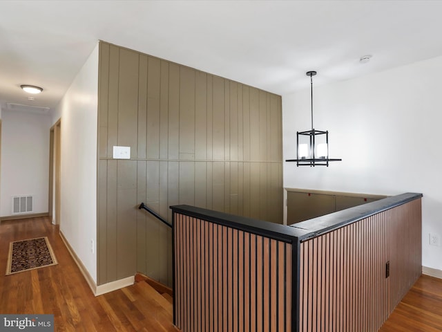 hallway with dark hardwood / wood-style flooring