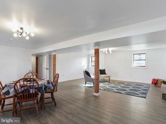 dining area featuring a chandelier and dark hardwood / wood-style floors