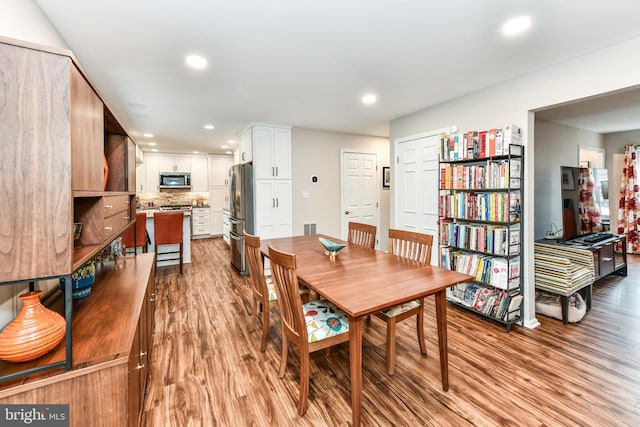 dining room with light hardwood / wood-style flooring