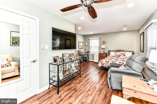 bedroom featuring hardwood / wood-style floors and ceiling fan