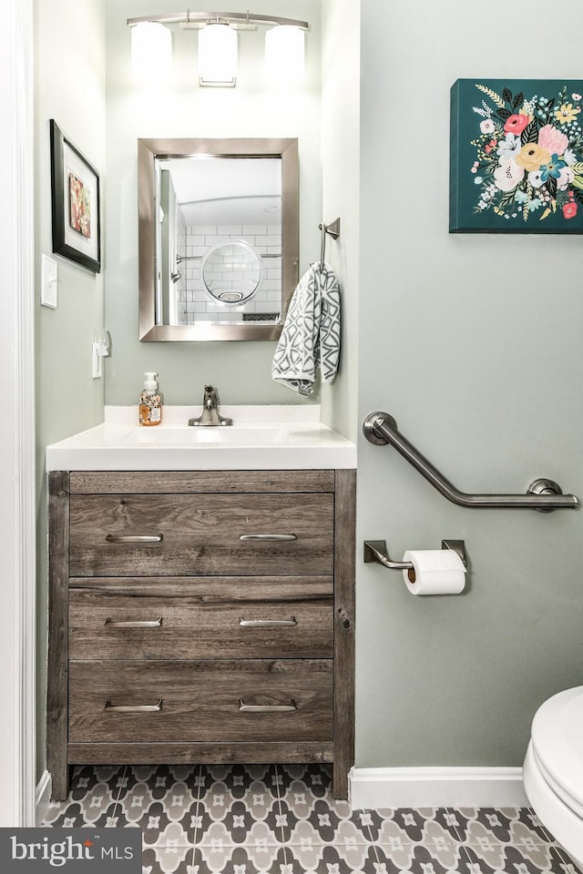 bathroom featuring vanity and toilet