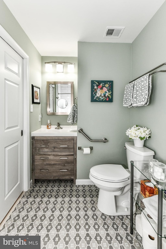 bathroom with vanity and toilet