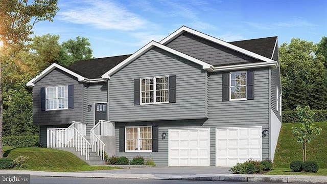 split foyer home with stairway, driveway, and a garage