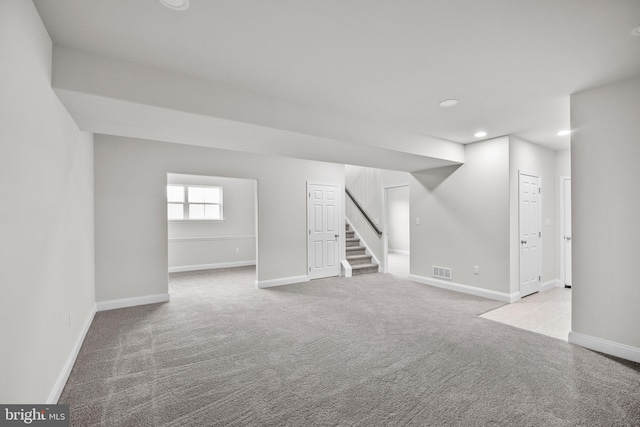 basement with light colored carpet